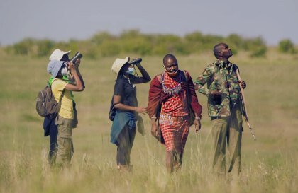 Guests on a guided bush walk with a naturalist and armed ranger