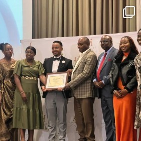 Soroi team receiving an award certificate