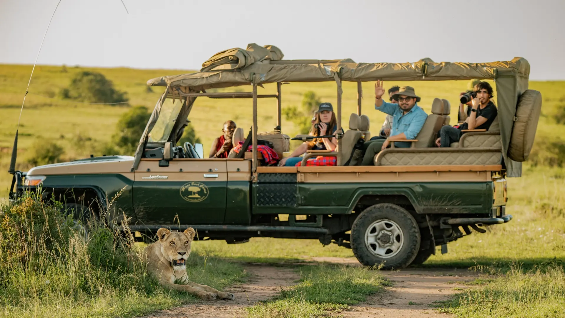 Guests on an open safari vehicle during a game drive